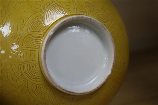 A Chinese yellow ground bowl (a.f.)and two blue and white dishes 19cm. & 16cm.